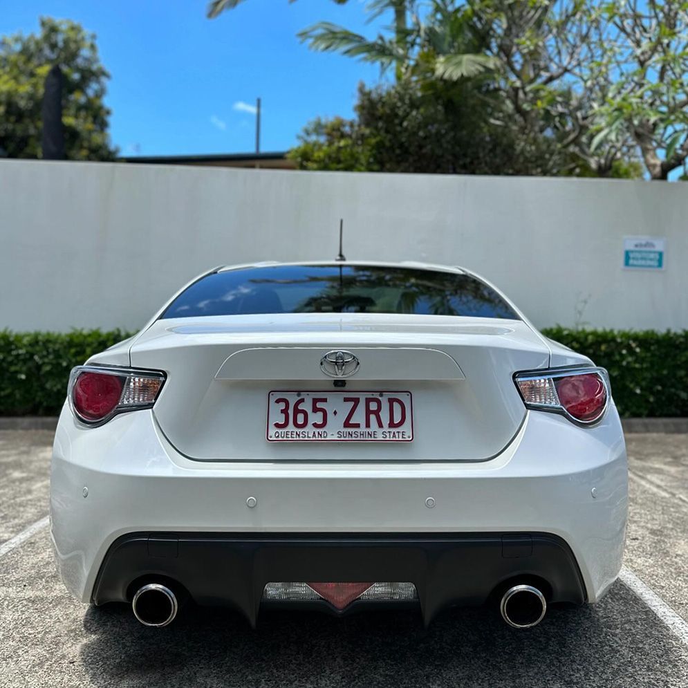 A White Car With A License Plate That Says 365 Zrd Is Parked In A Parking Lot — Remedy Mobile Car Detailing in Currumbin, QLD
