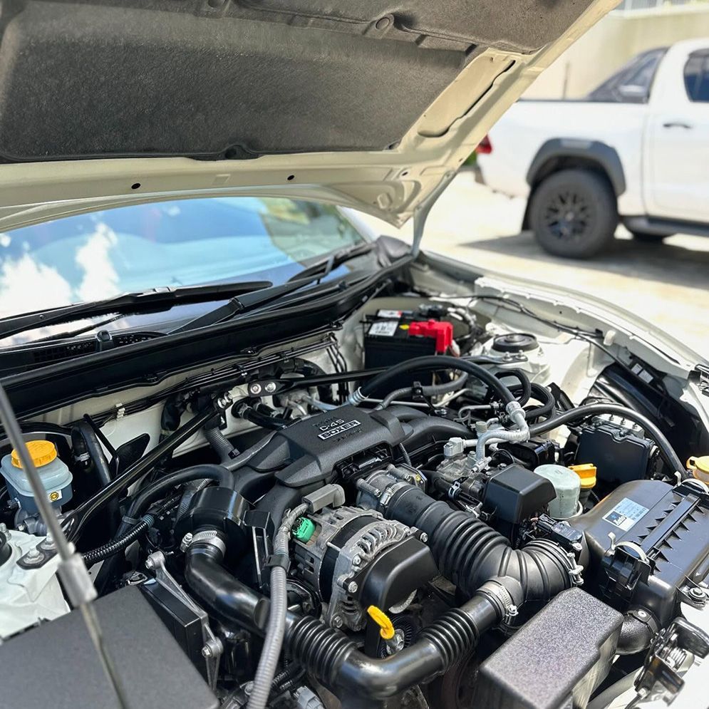 A Close Up Of A Car Engine With The Hood Open — Remedy Mobile Car Detailing in Currumbin, QLD