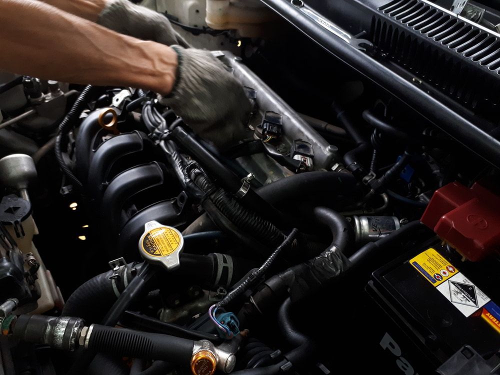 A Man is Working on the Engine of a Car — ANI Automotive in Long Jetty, NSW