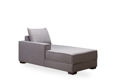 Rückenansicht einer grauen Liege mit einem Kissen darauf.