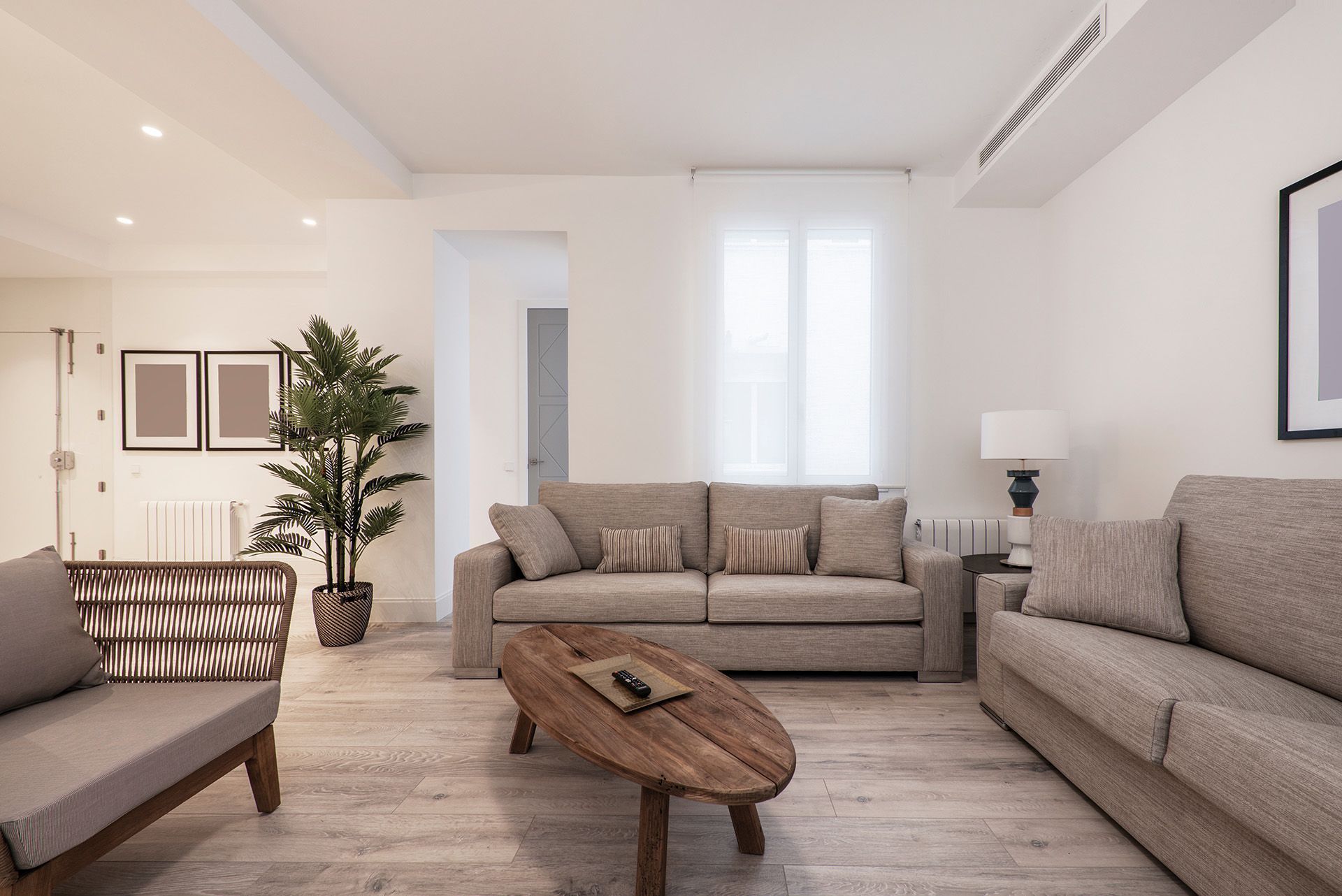 A living room with a couch, chairs, and a coffee table.