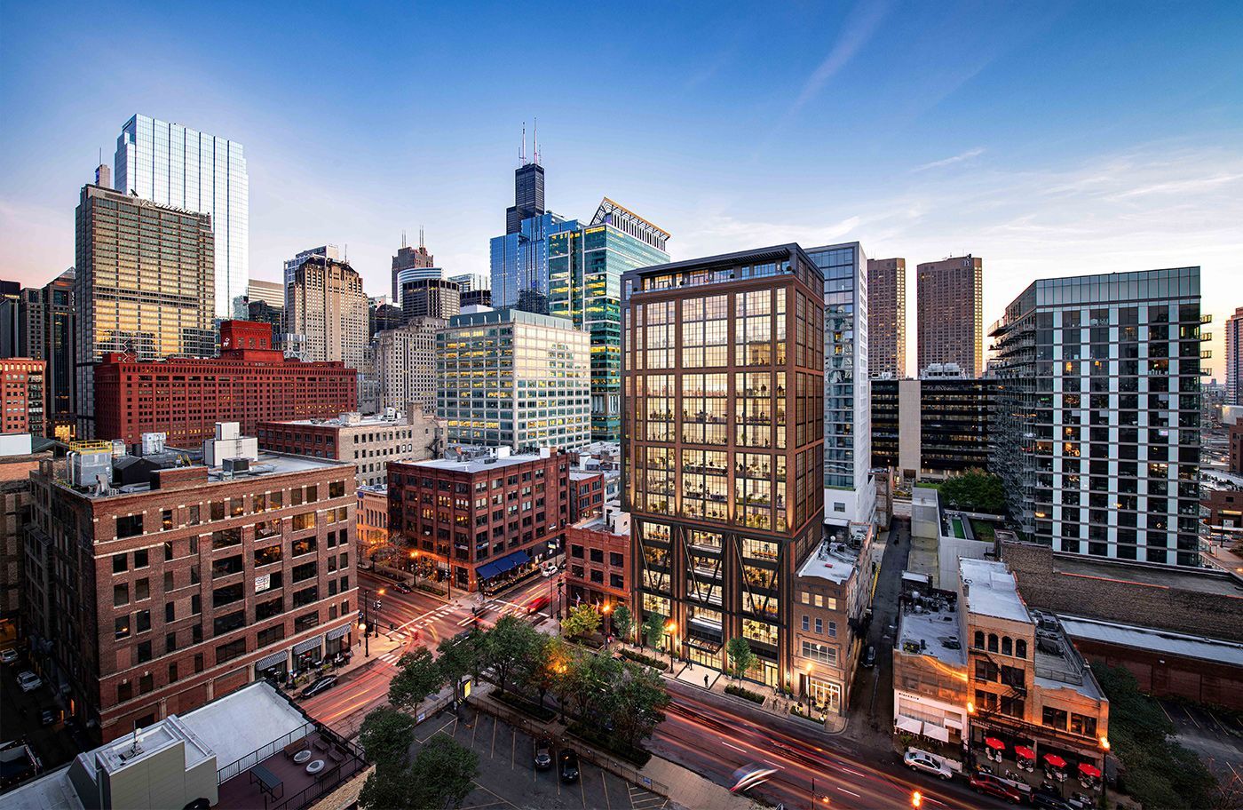 An aerial view of a city skyline with a large building in the middle.