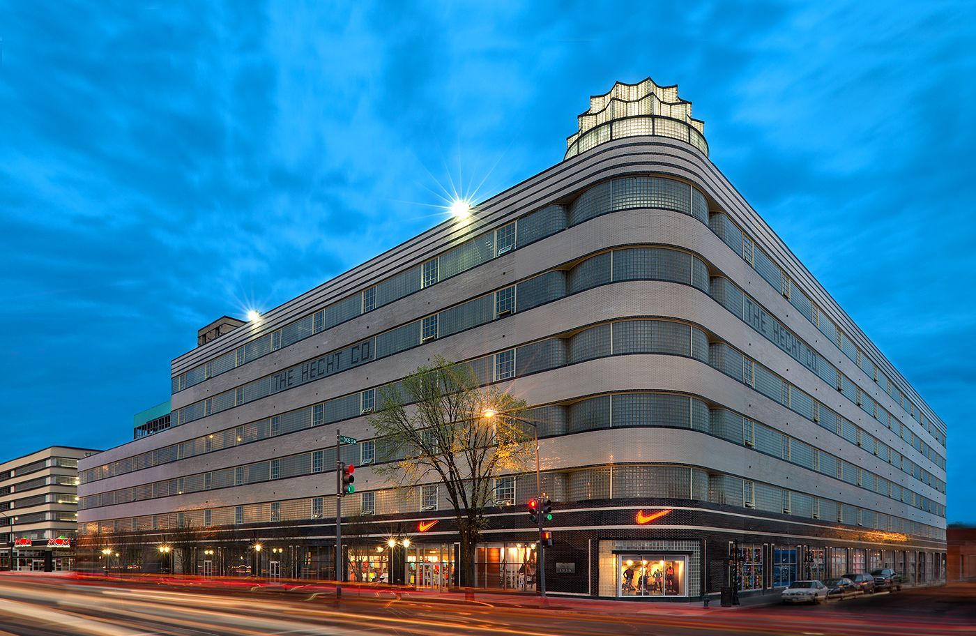 A large white building with a clock on top of it.