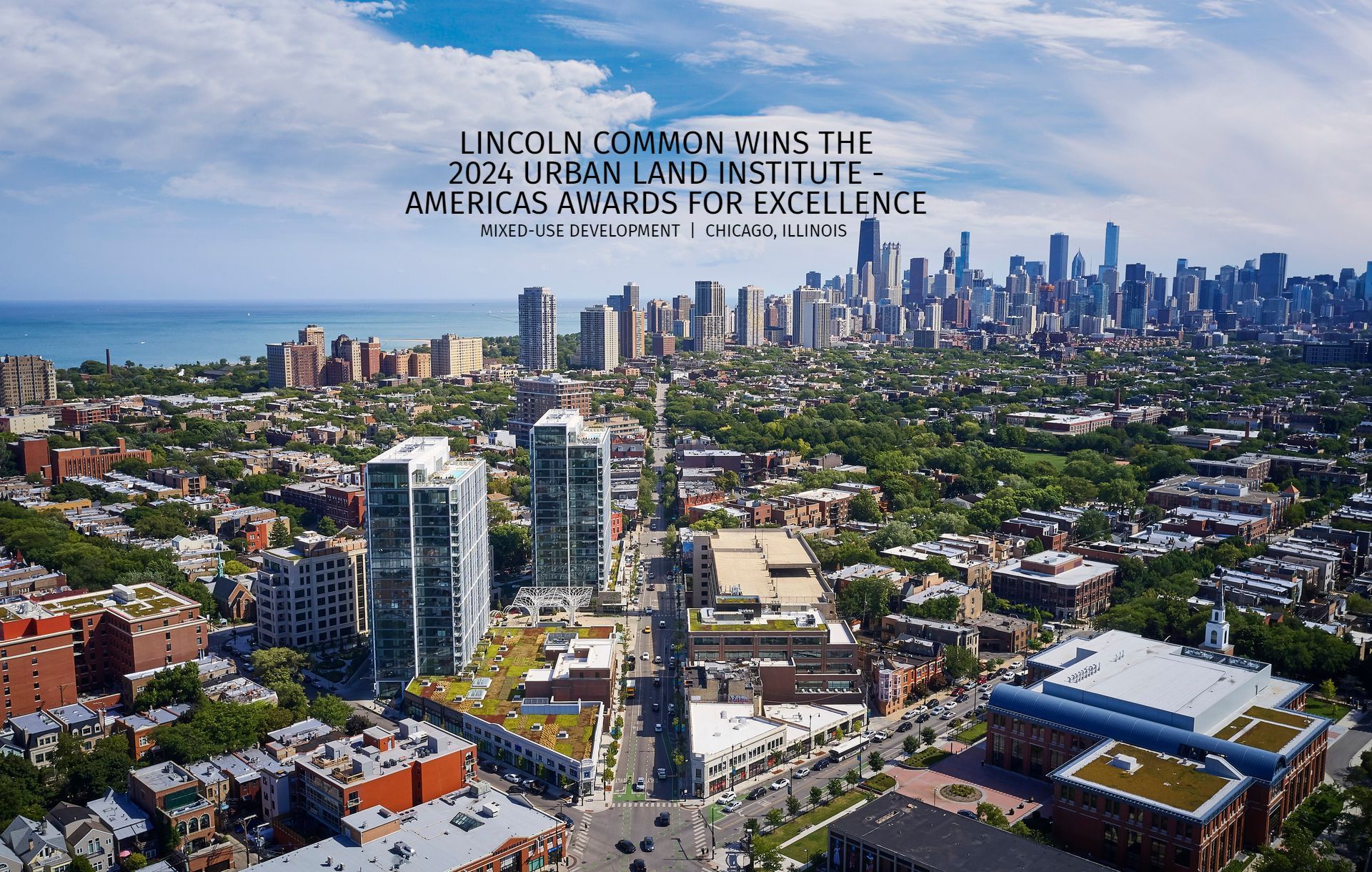 An aerial view of a city with the words lincoln common wins the americas awards for excellence