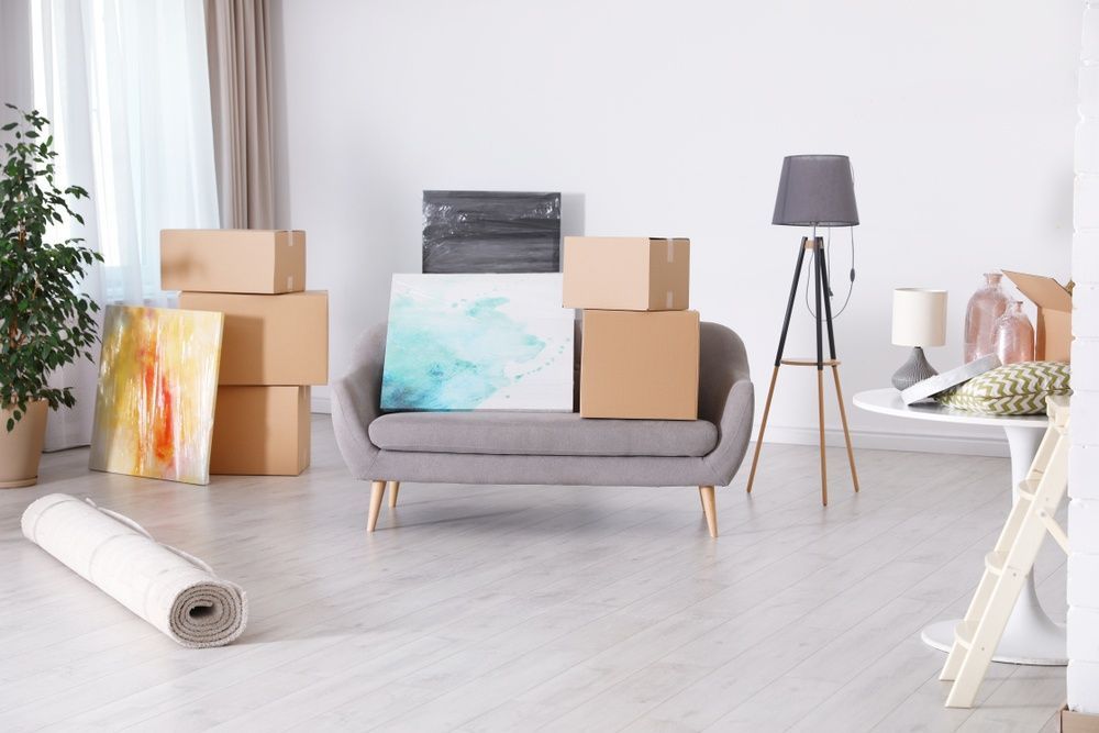 A Living Room Filled With Boxes and a Couch — Removalists in Tweed Heads