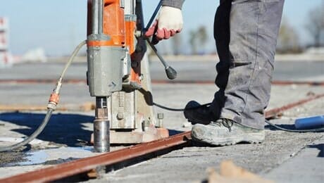 Man drilling concrete — Concrete Grinding in Cairns,QLD