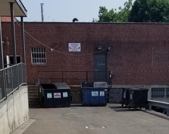 a brick building with a sign that says 