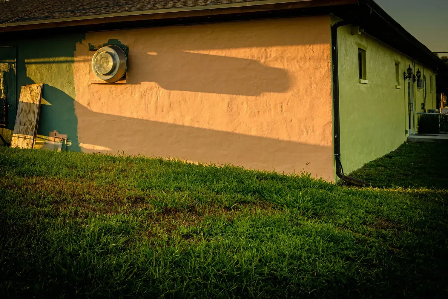 A house with a shadow on the side of it