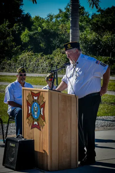 A man is standing at a podium giving a speech.