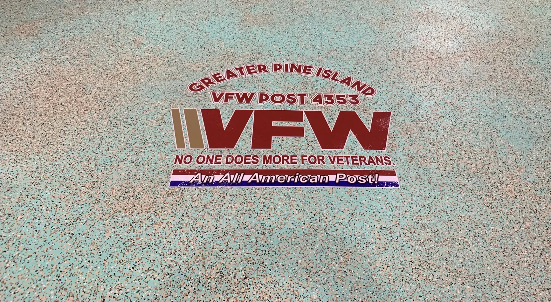 A sign on a wall that says no one costs more for veterans