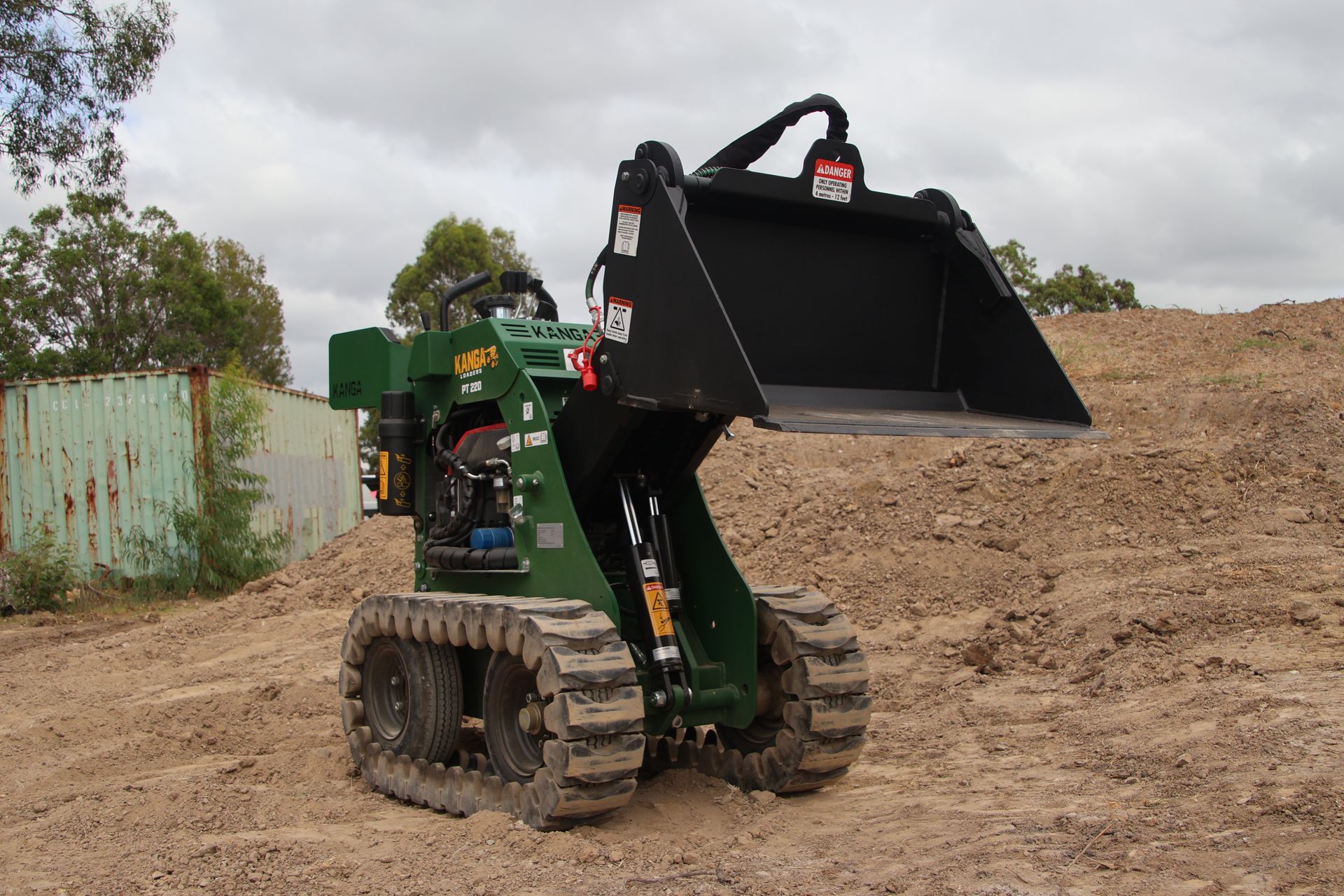 Green and yellow mini skid steer loader with bucket — Forecast Machinery in Yarrawonga, NT