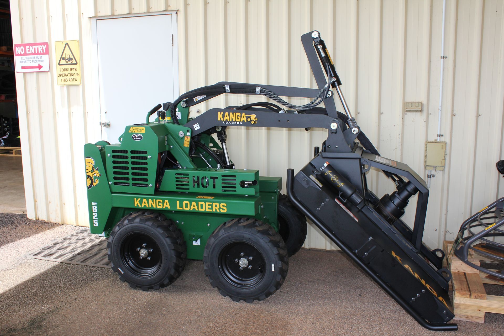 Green and black Kanga Loader mini skid steer with bucket on white background — Forecast Machinery in Yarrawonga, NT