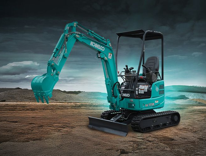 Teal Kobelco excavator on treads, with a cab and raised arm, outdoors — Forecast Machinery in Yarrawonga, NT
