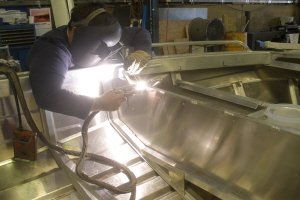 welder welding large stainless steel item