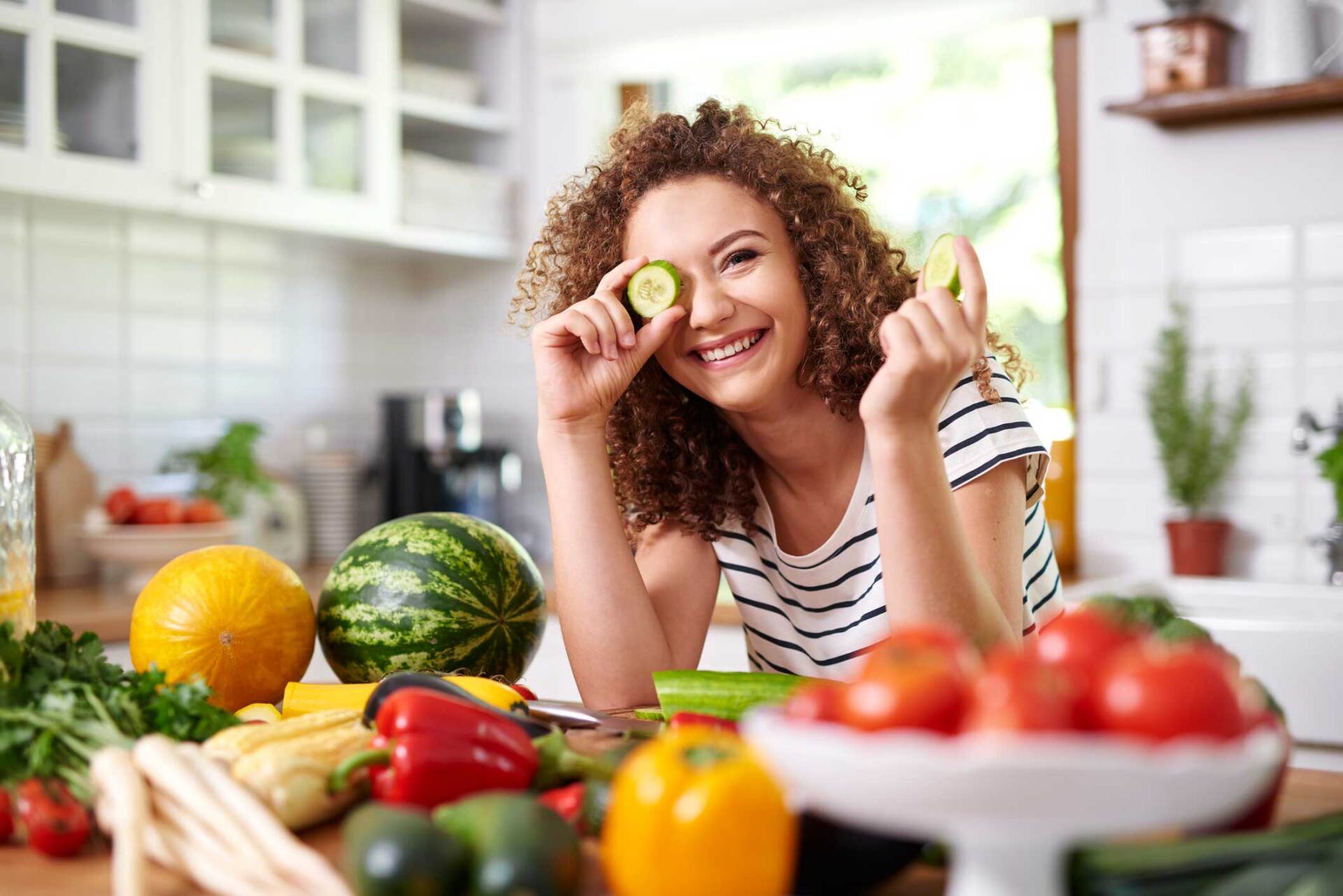 Woman Surrounded By Healthy Food — Jacksonville, FL | Fulton Gibbs Wellness