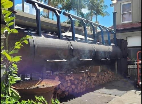 Pile Of Firewood And Big Smoking Oven - Firewood in Toowoomba,