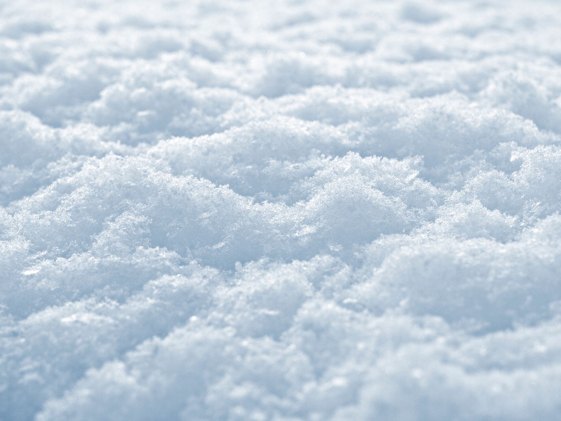 a close up of a pile of snow that looks like clouds .