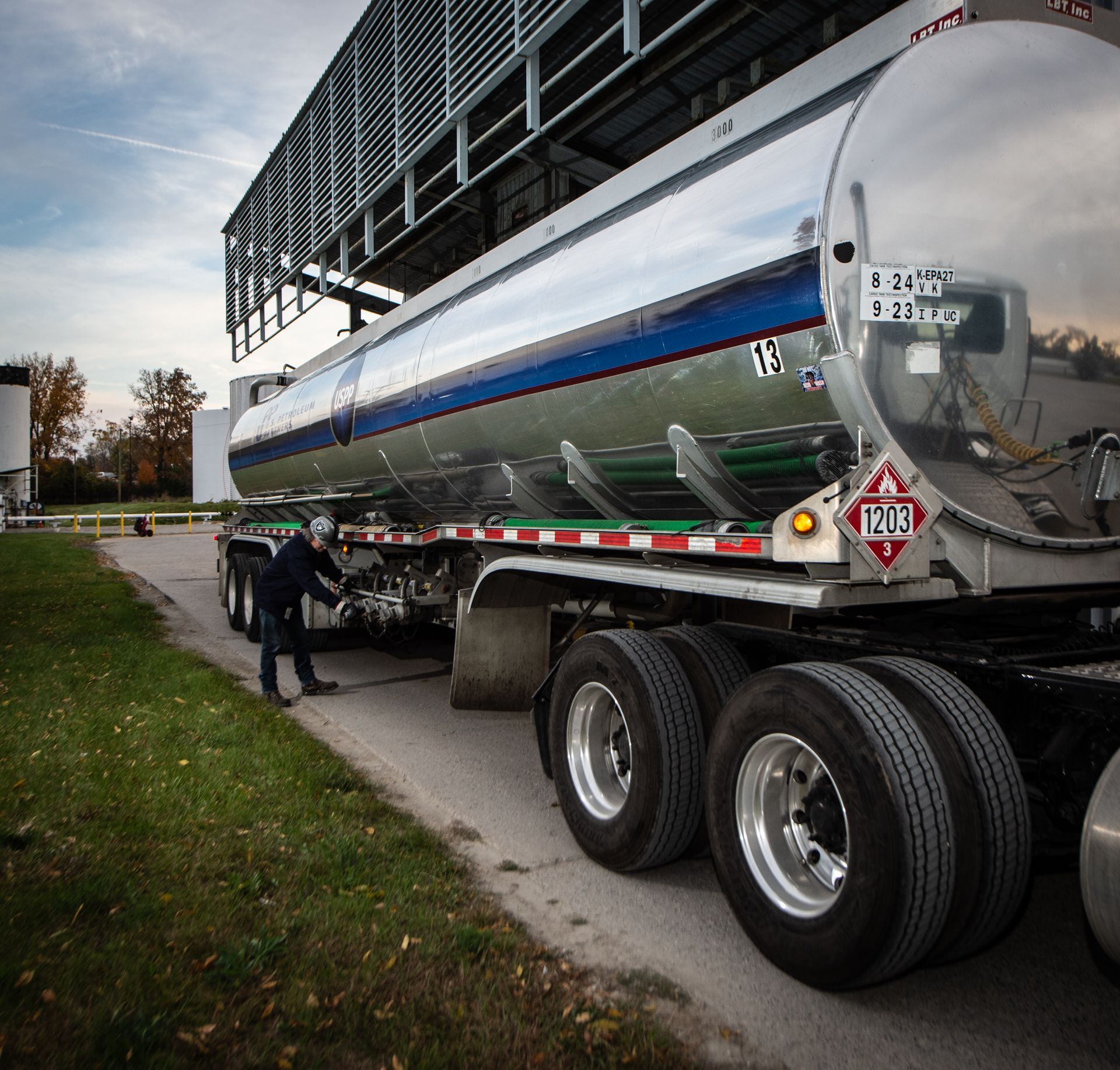 USPP Truck with man adjusting items on trailer