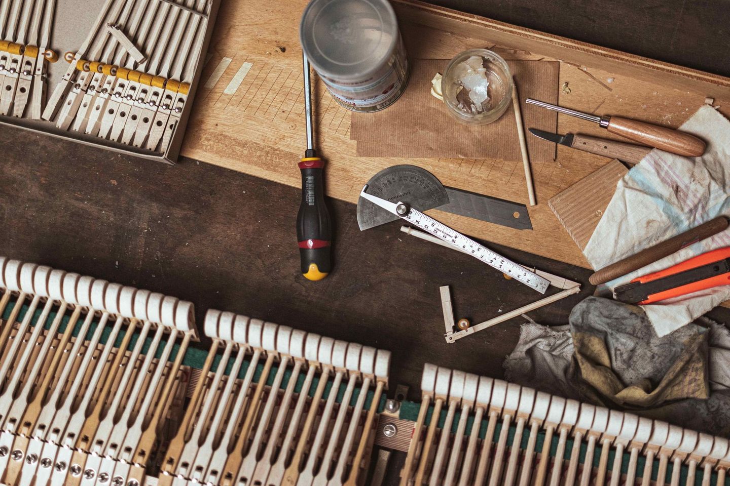 a piano is being repaired with tools on a table