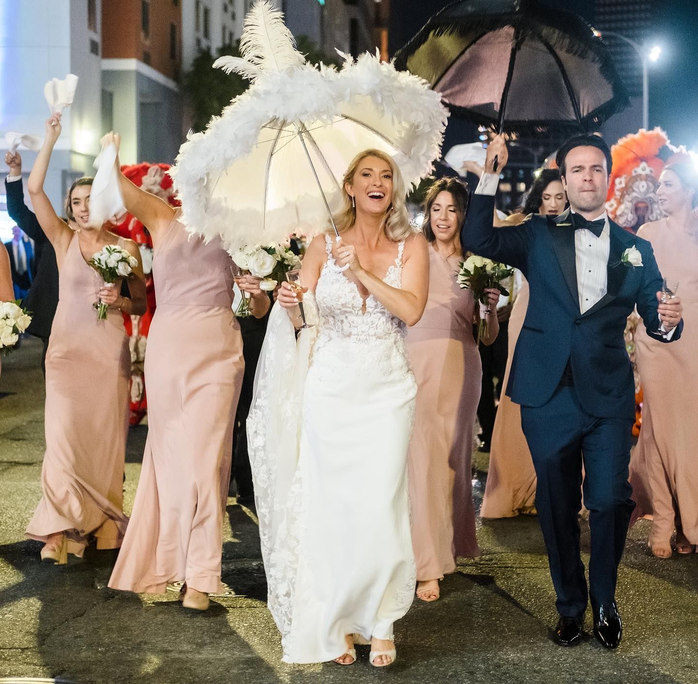 A large room filled with tables and chairs and a chandelier.