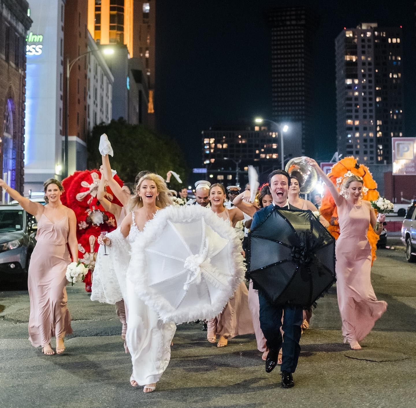 A large room filled with tables and chairs and a chandelier.