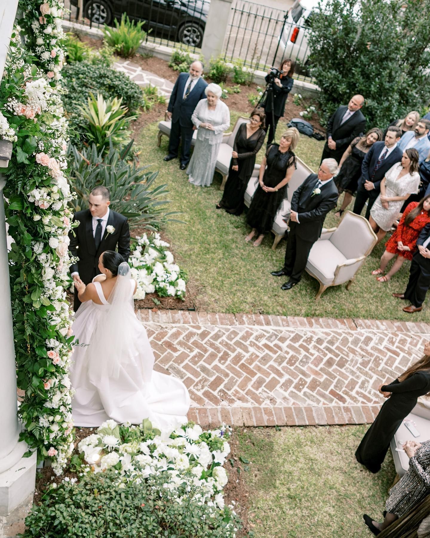 A large room filled with tables and chairs and a chandelier.