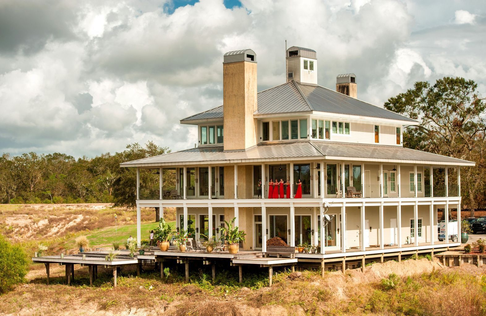 A large house with a lot of windows and porches
