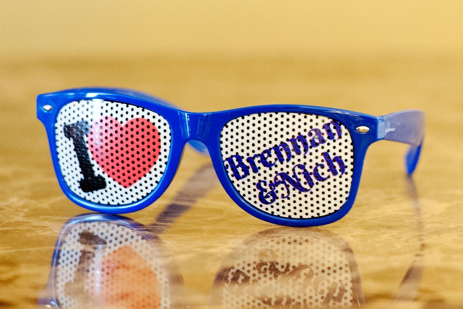 A pair of sunglasses that say i heart brennbach