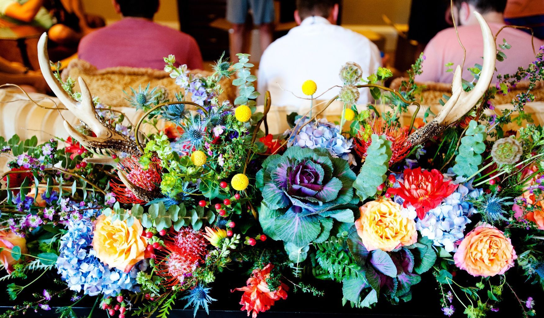A bunch of flowers are sitting on top of a table.