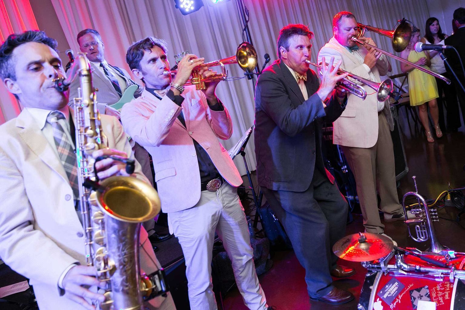 A group of men are playing instruments on a stage.