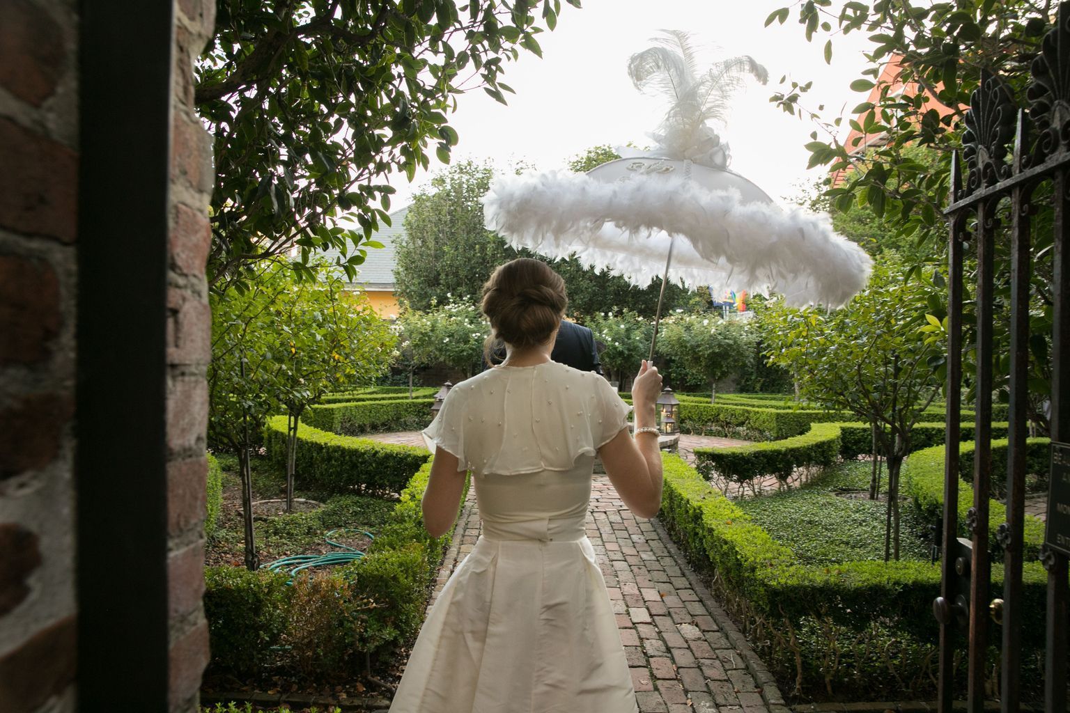 A large room filled with tables and chairs and a chandelier.