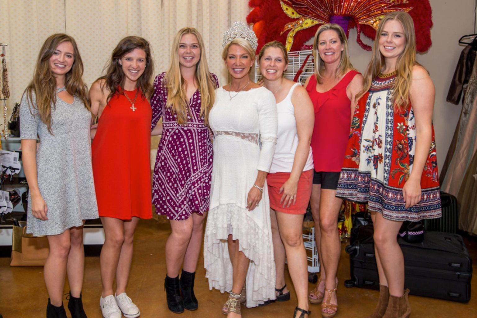 A group of women are posing for a picture together.