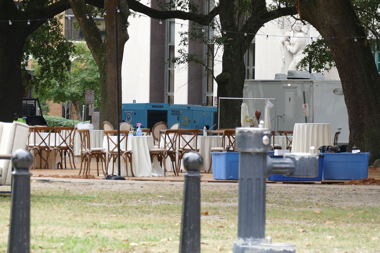 A park with tables and chairs set up for a party