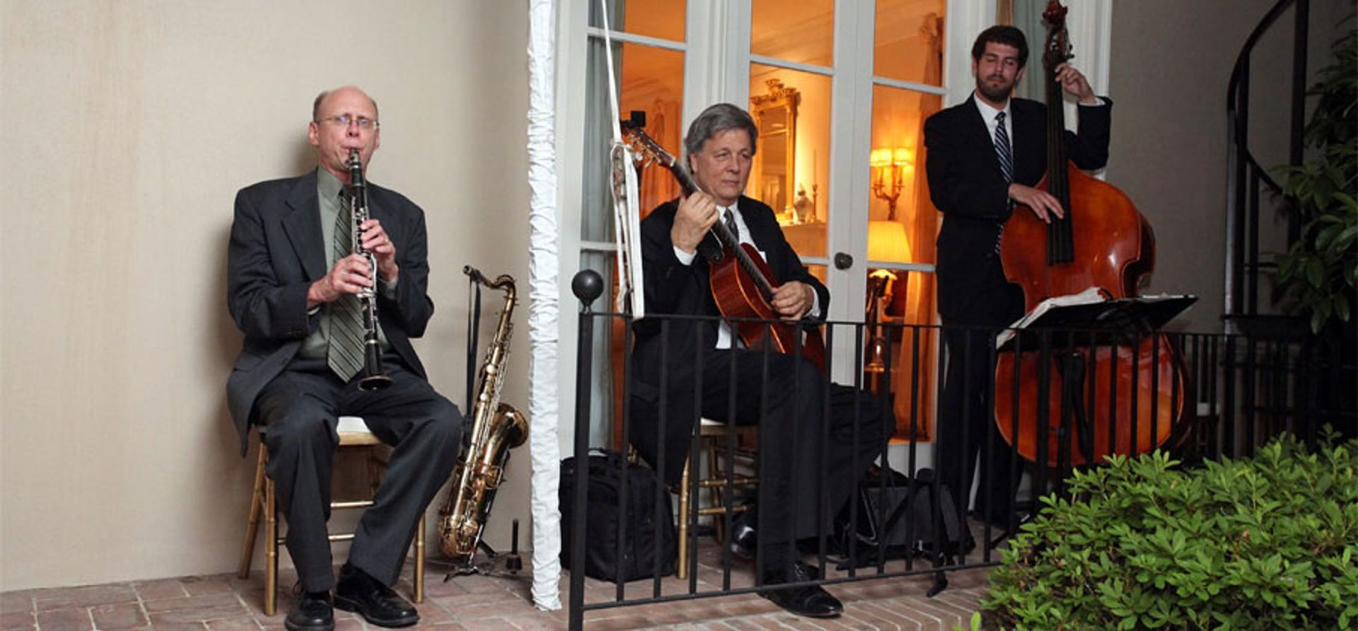 A large room filled with tables and chairs and a chandelier.