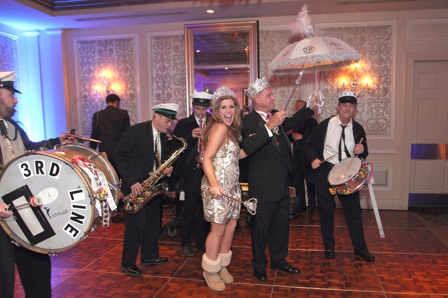 A woman is standing in front of a drum that says 3rd line on it