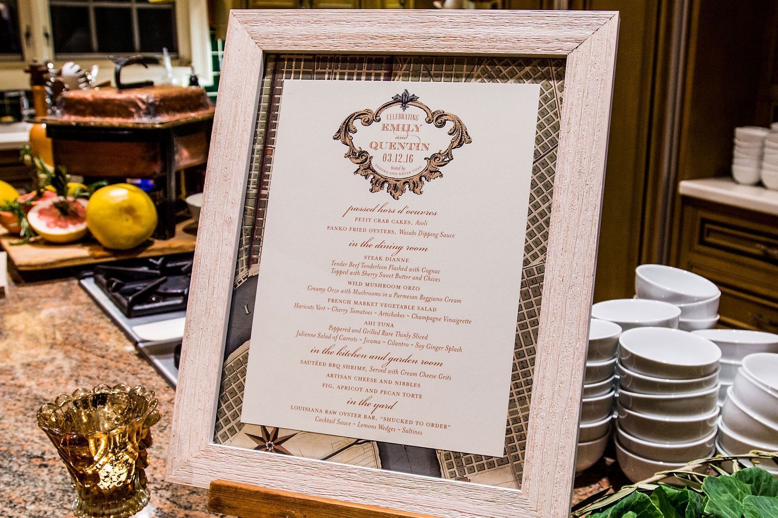 A framed menu is sitting on a counter in a kitchen.