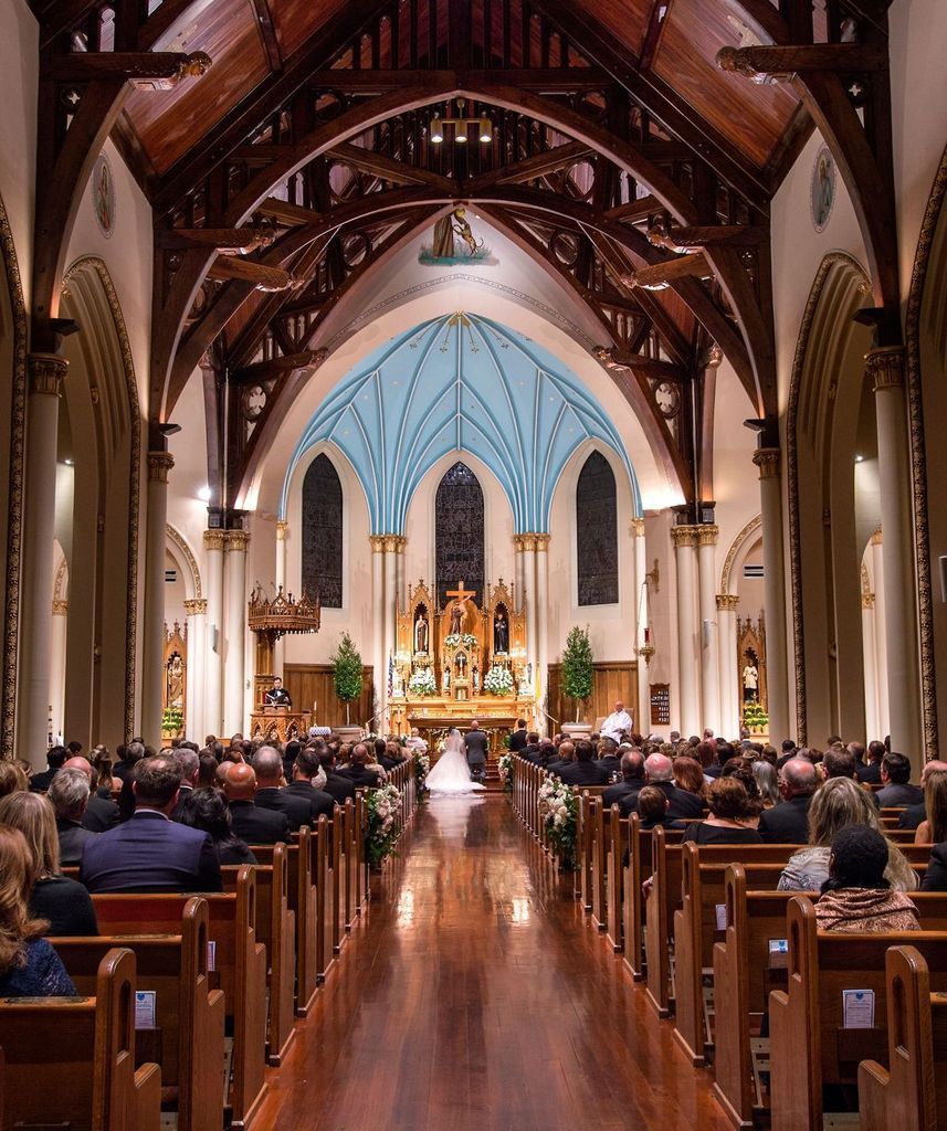 A bride and groom are getting married in a church
