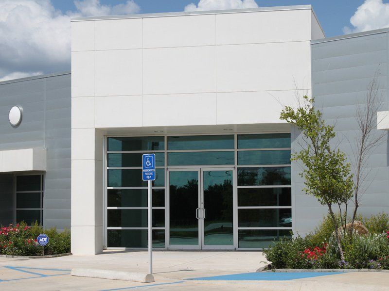 A building with a handicapped parking spot in front of it