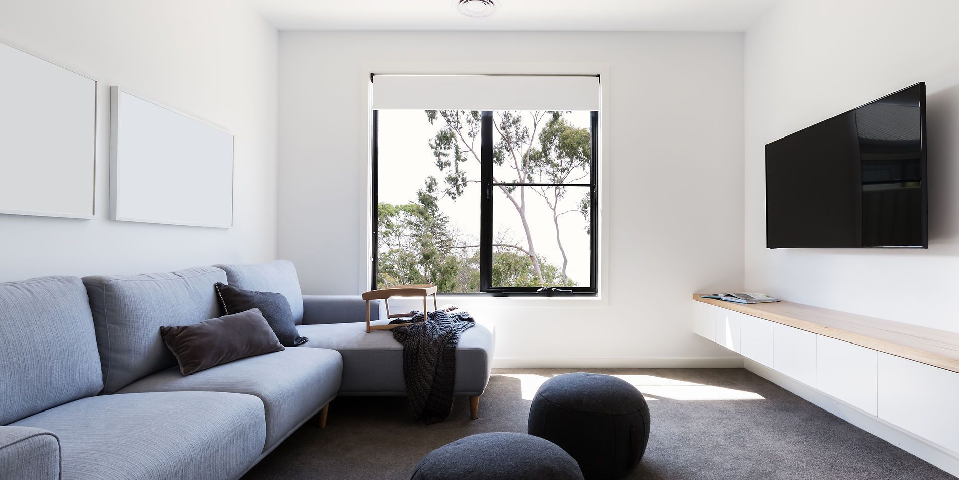 3Cs Audio-Visuals LLC | Wall-mounted TV installation with concealed cables in modern Atlanta living room