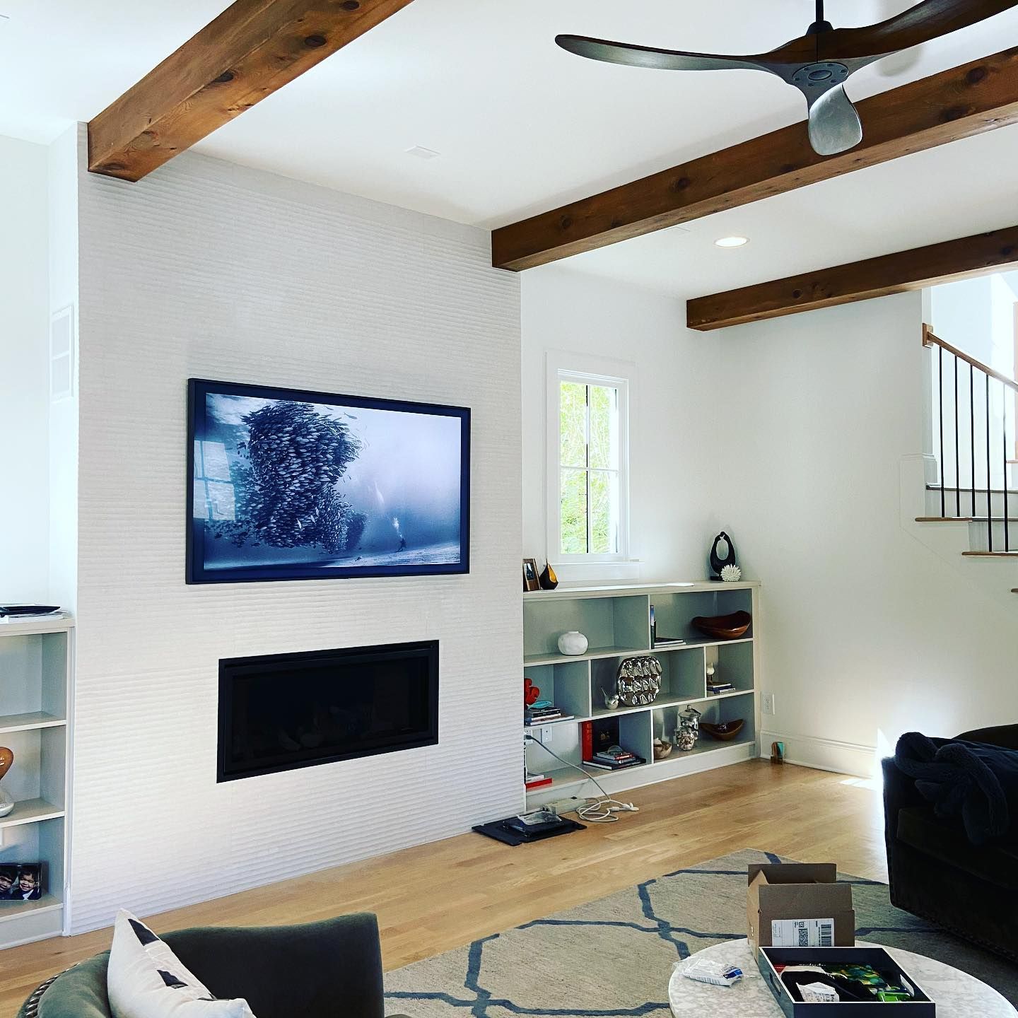 3Cs Audio-Visuals LLC | Above fireplace TV mounting with concealed cables in modern Atlanta home