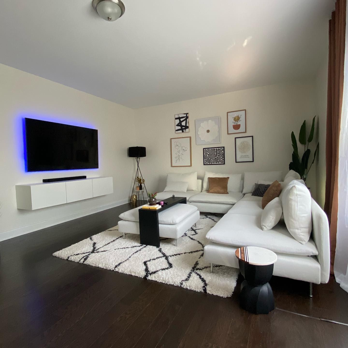 3Cs Audio-Visuals LLC | Home TV mounting with ambient blue LED lighting and sleek AV setup in Atlanta