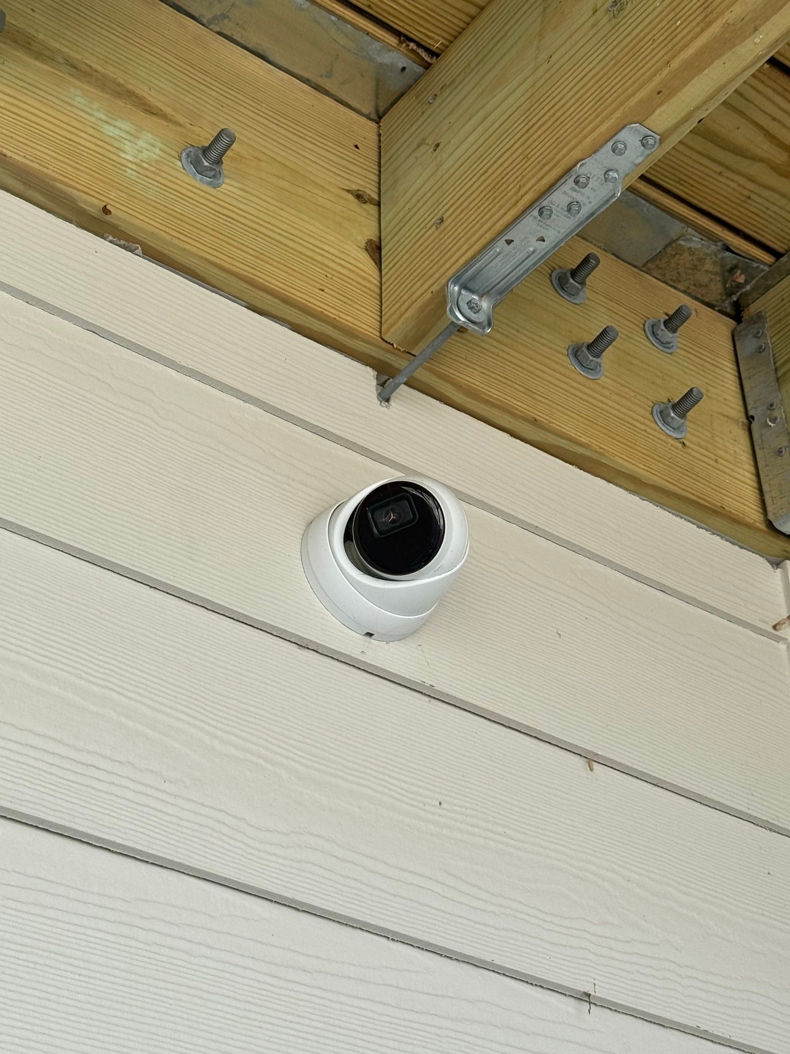 3Cs Audio-Visuals LLC | Outdoor surveillance camera installation under deck for custom surveillance solutions