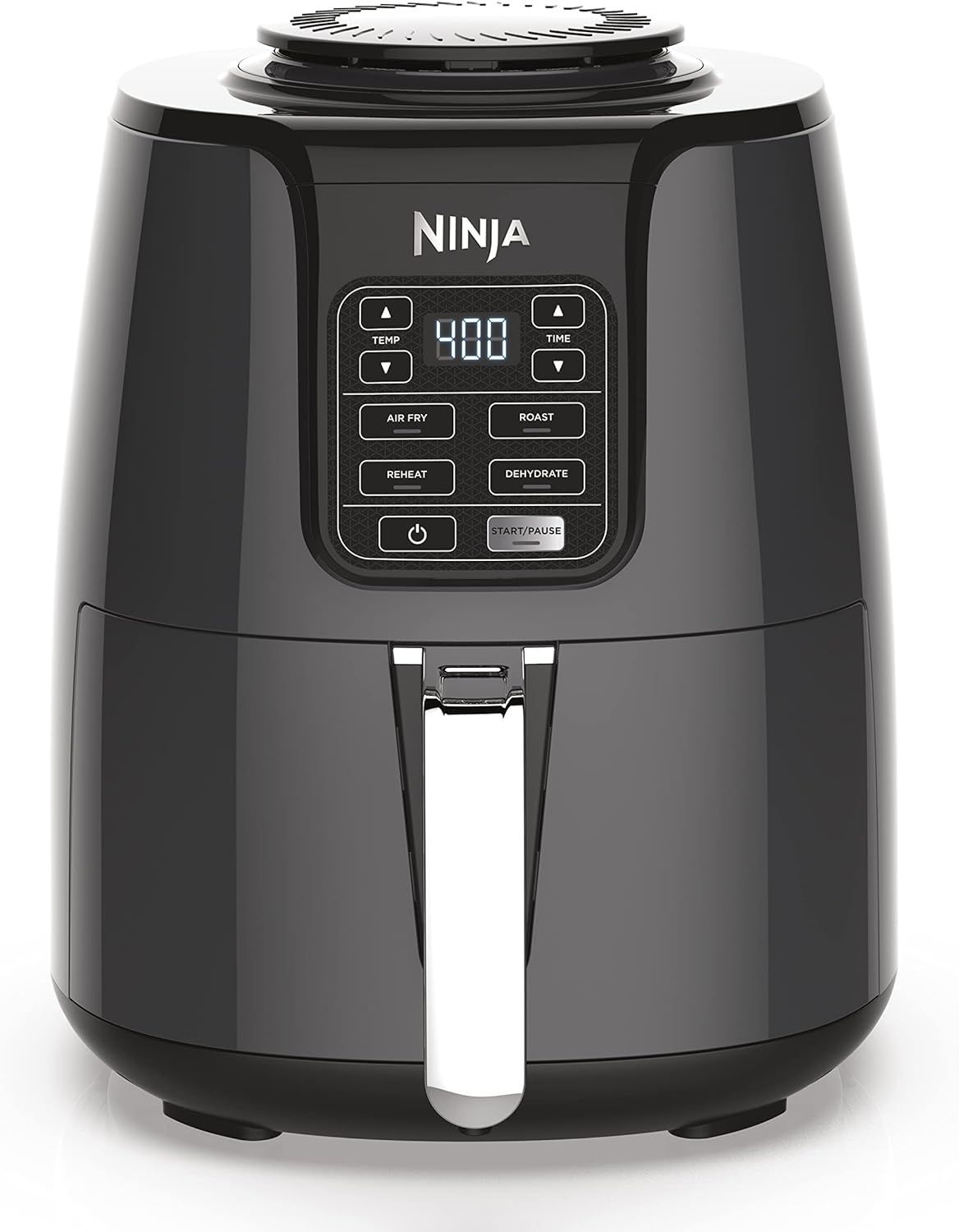A black ninja air fryer is sitting on a white surface.