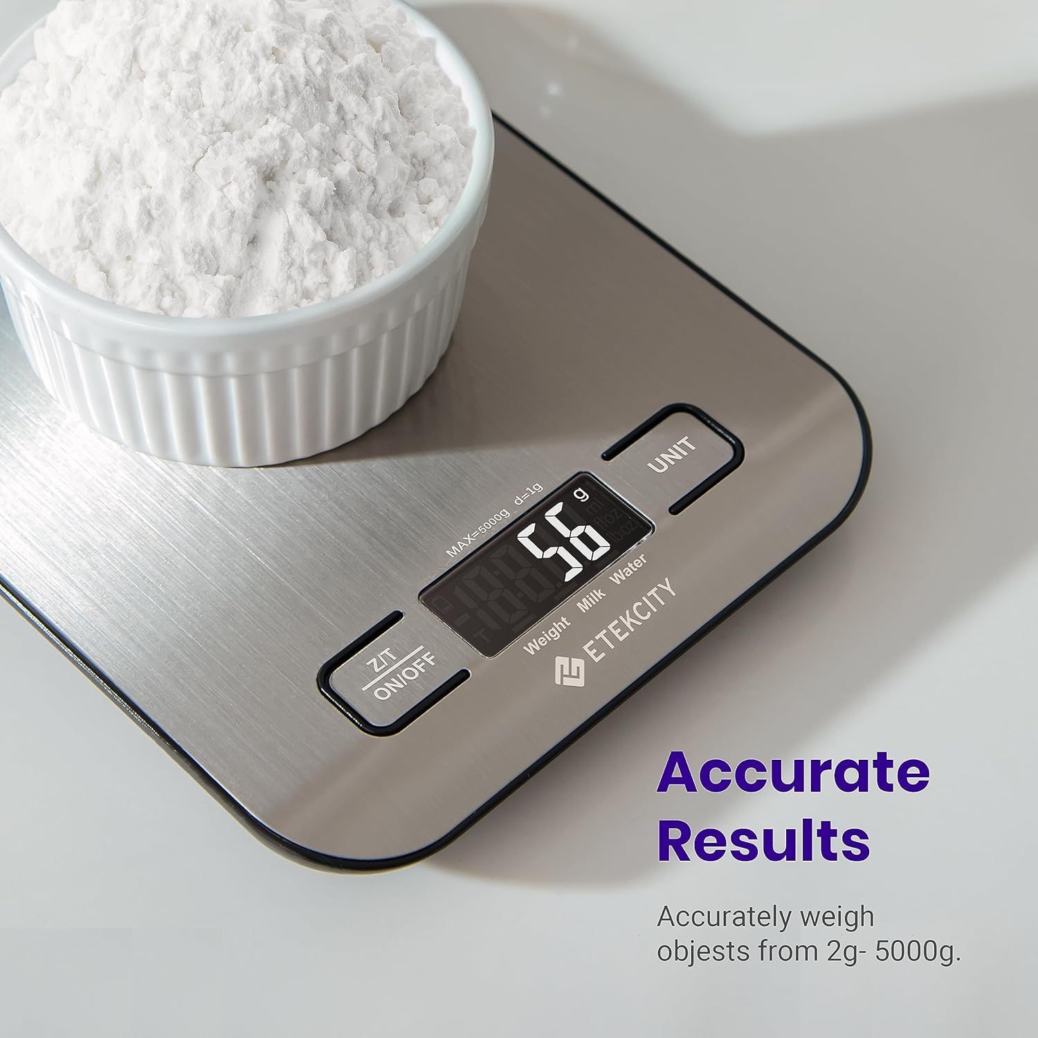 A digital scale with a bowl of flour on it