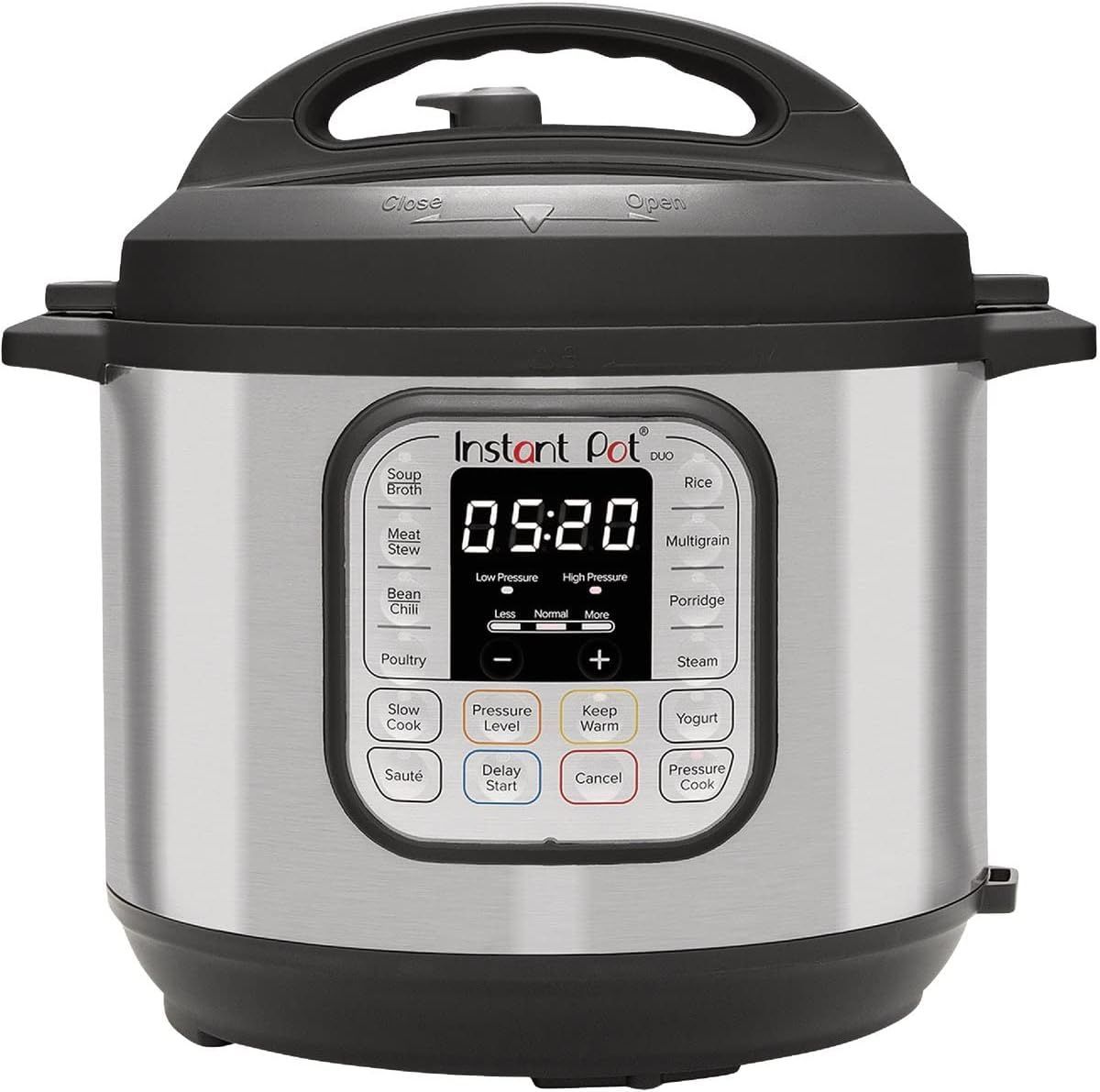 A stainless steel instant pot with a black handle on a white background.