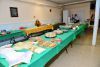 A room filled with tables and plates of food.
