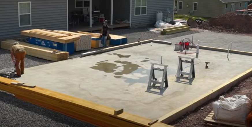 A newly poured foundation, ready for garage building
