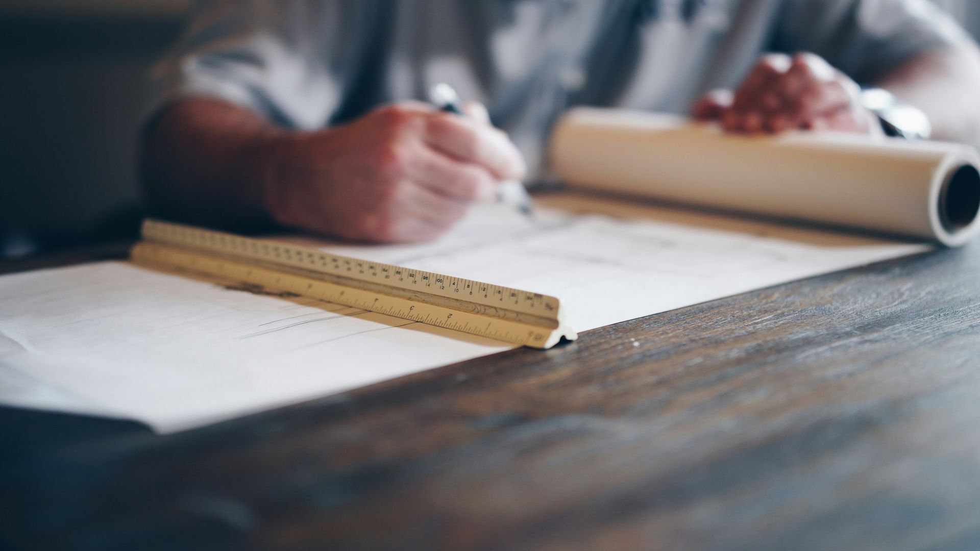 A man working a on a garage construction floor plan