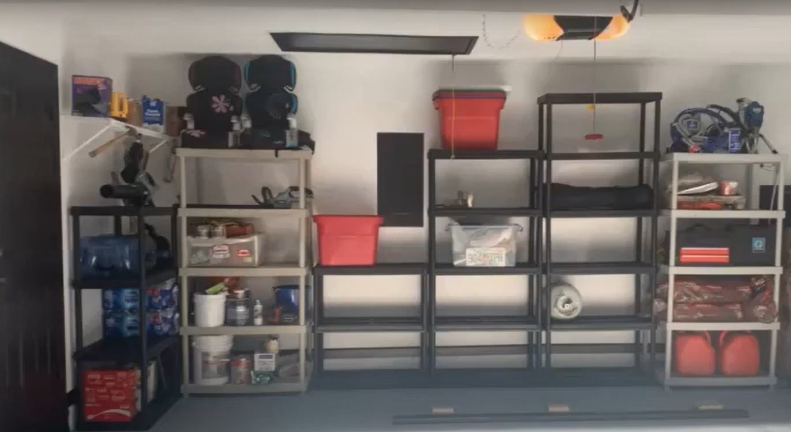 Garage after renovation with newly finished floor and walls.