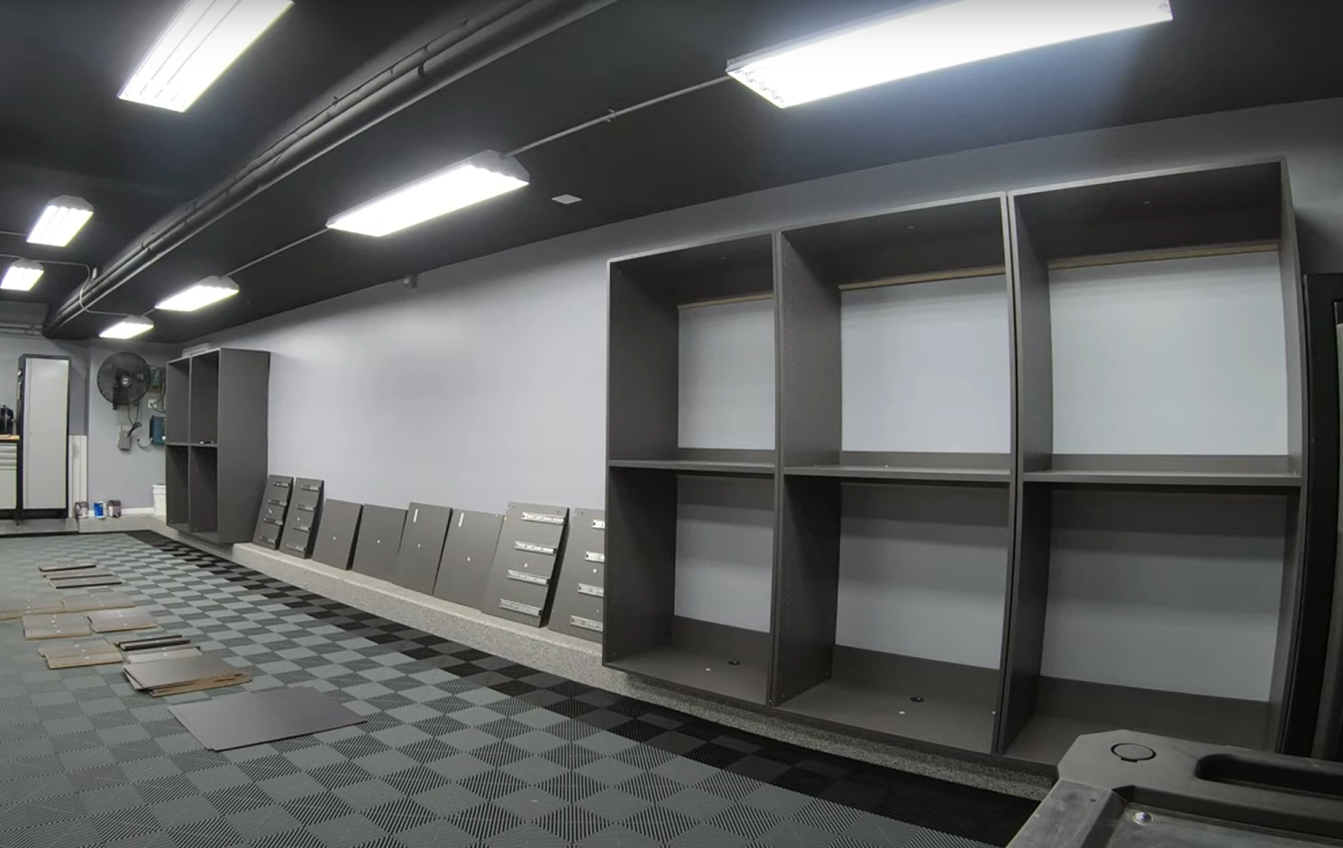 Shelving being added to renovated garage